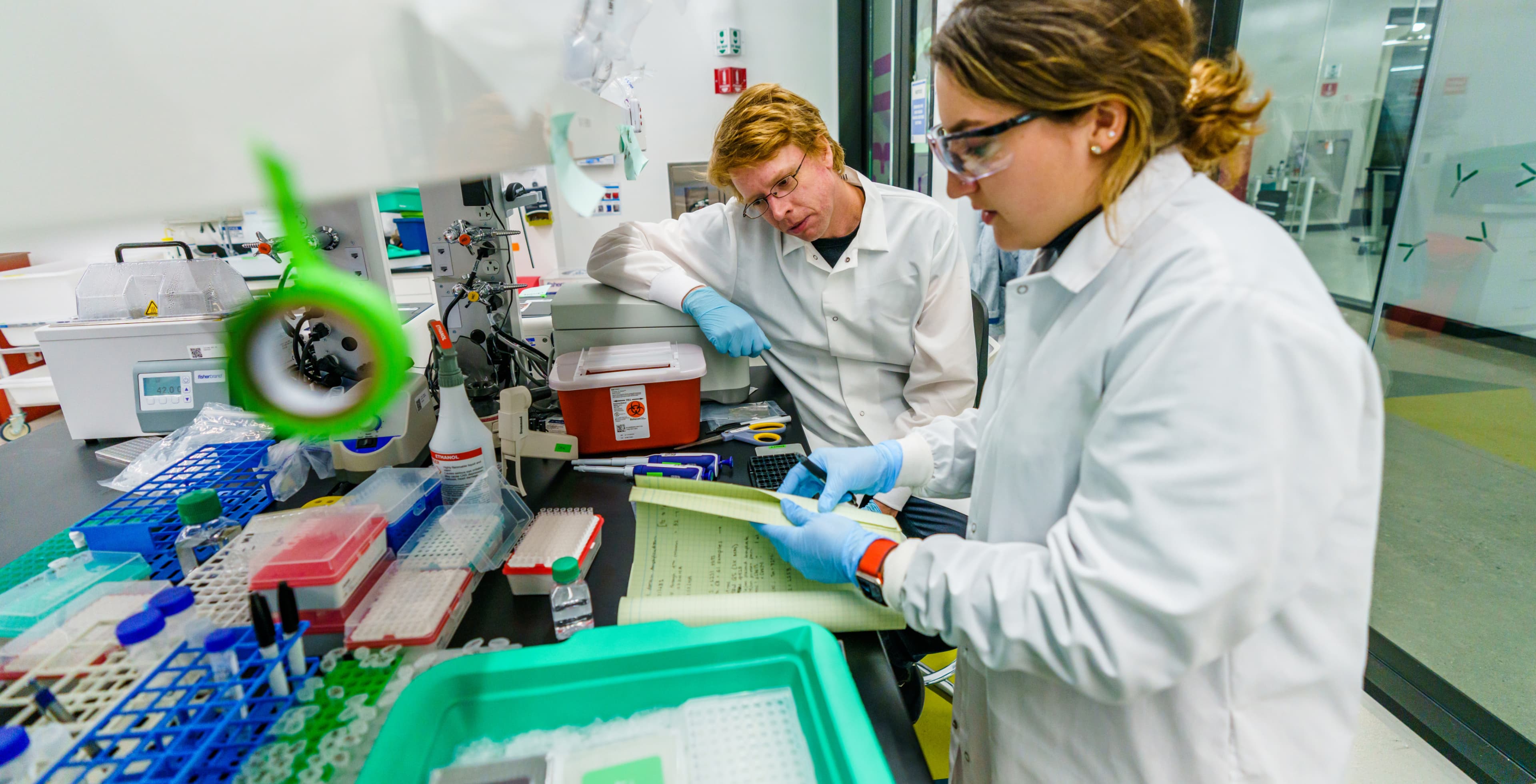 Professor Luke Gilbert in lab with a student