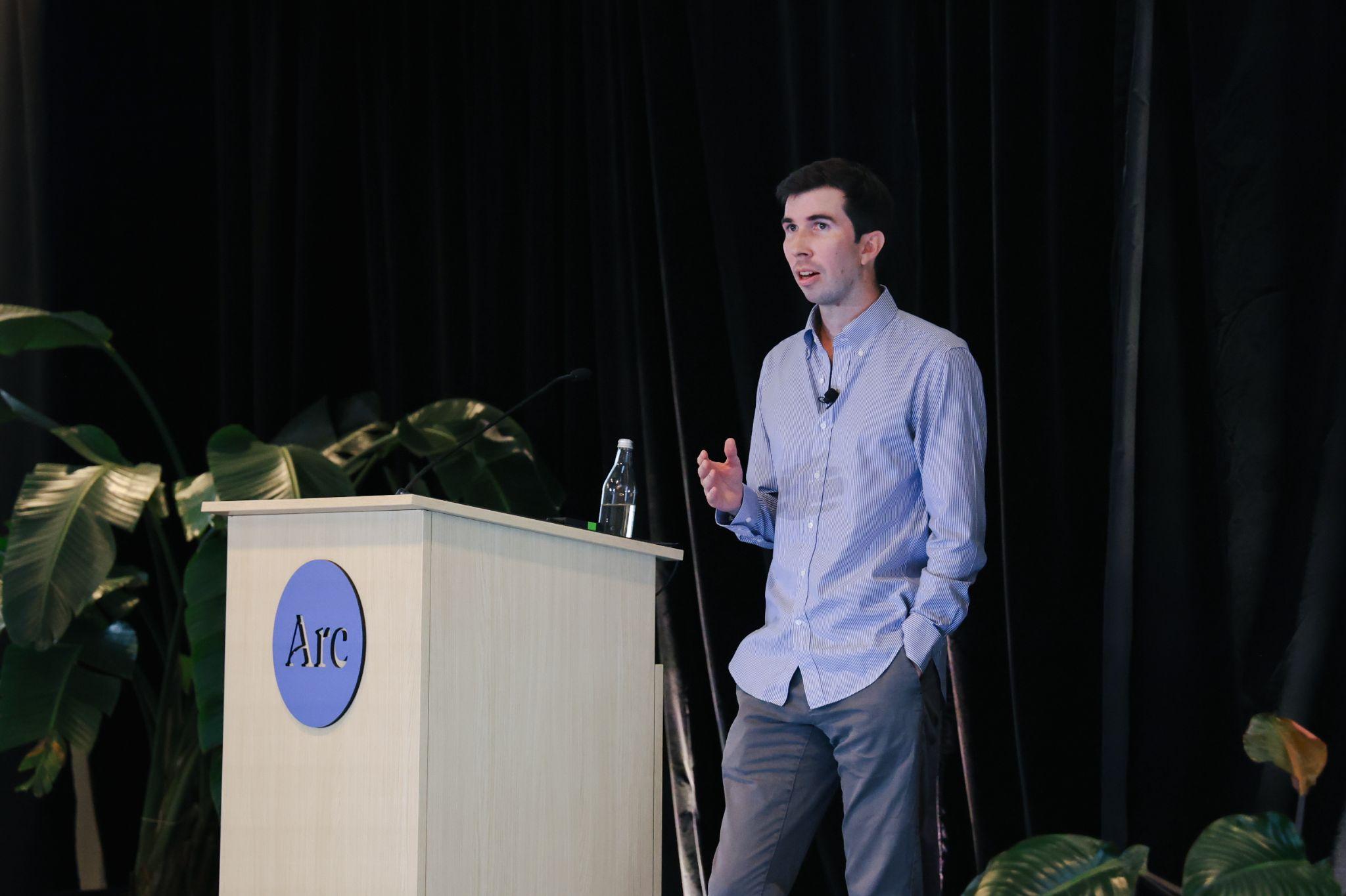 Arc Core Investigator John Pluvinage speaking at an Arc Institute event